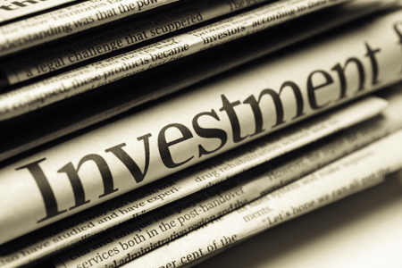newspaper detailing investment disputes